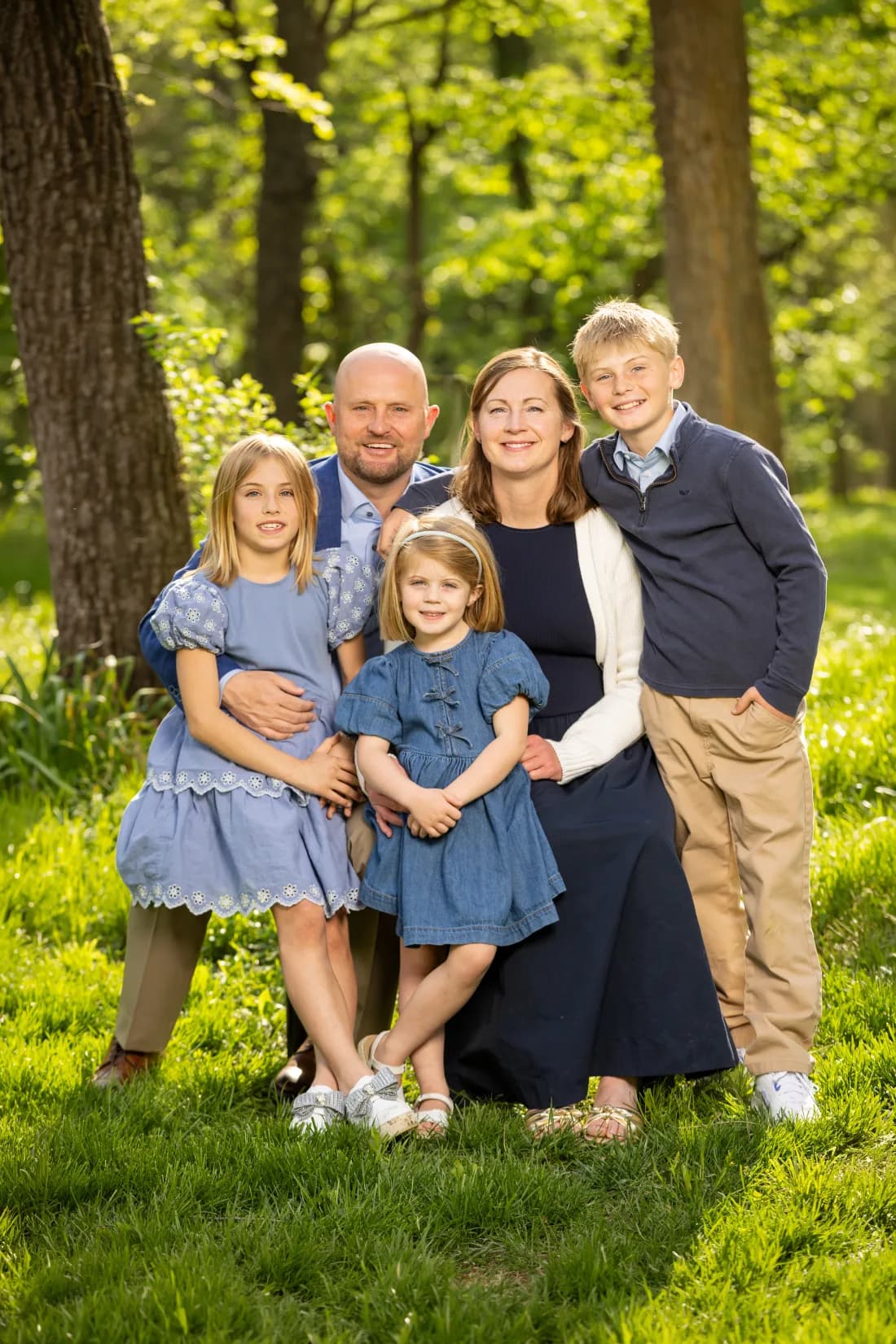 Wes Rogers and the Rogers family in a sunlit Kansas City woods